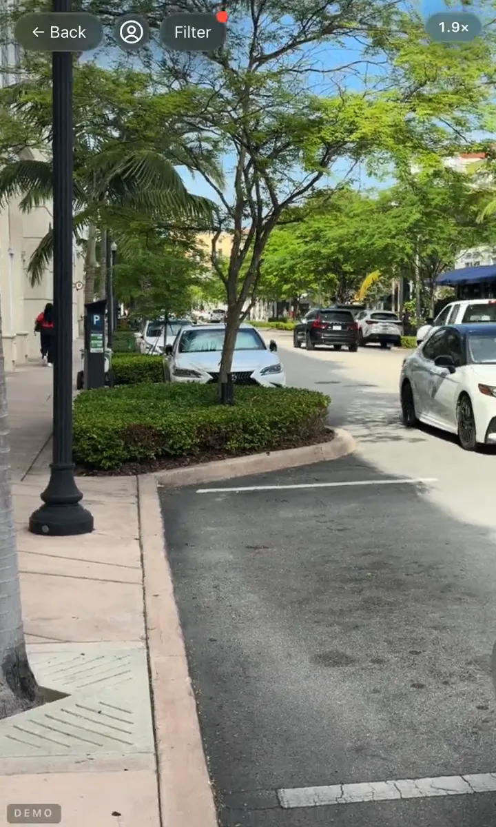 CurbScope's camera view: live property cards floating over real Miami homes